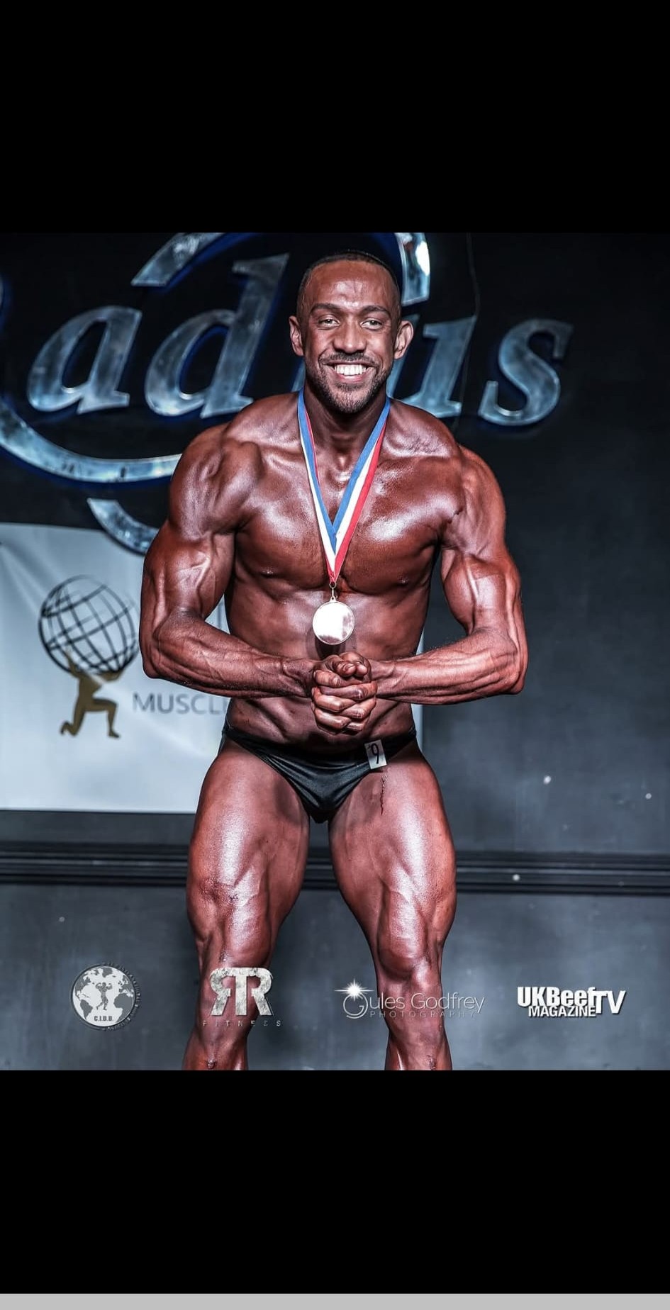 Josh with medal at Radius bodybuilding competition